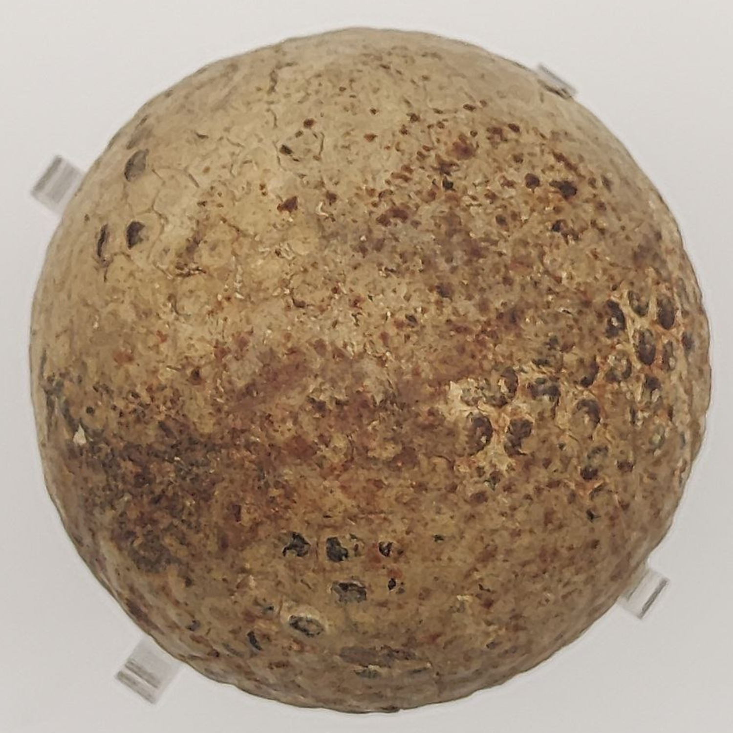 Antique golf ball close up view on a light background