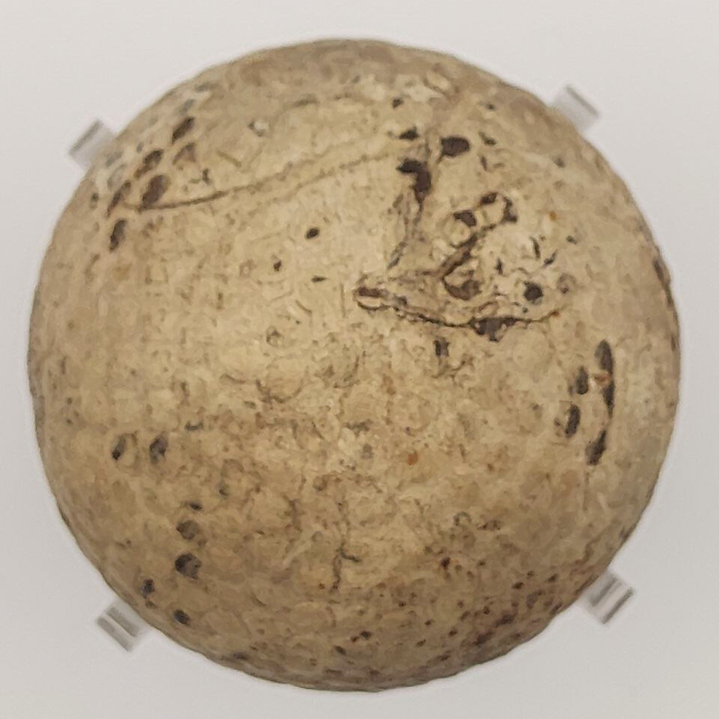 Antique Scottish golf ball on a light background