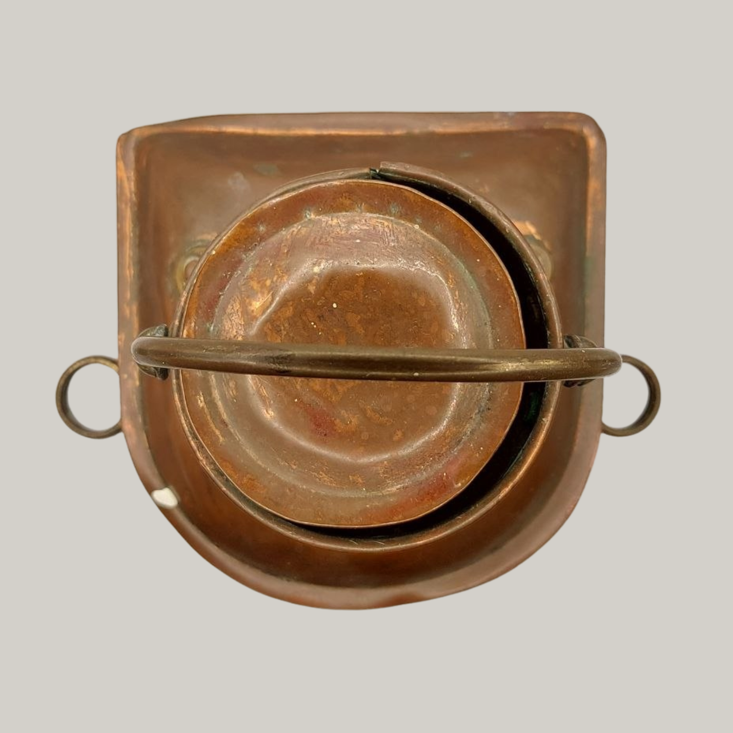 Copper lantern on a grey background
