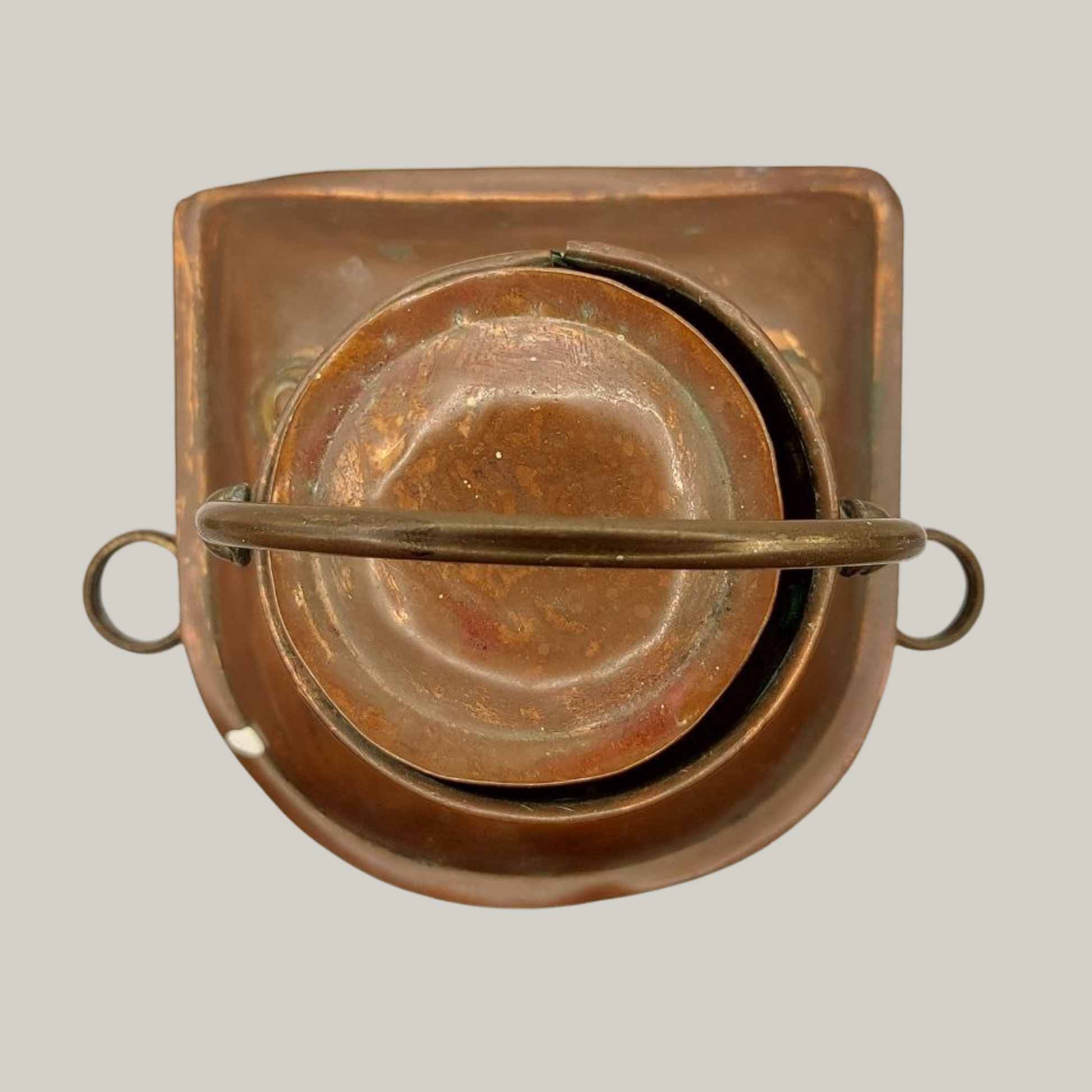 Copper lantern on a grey background
