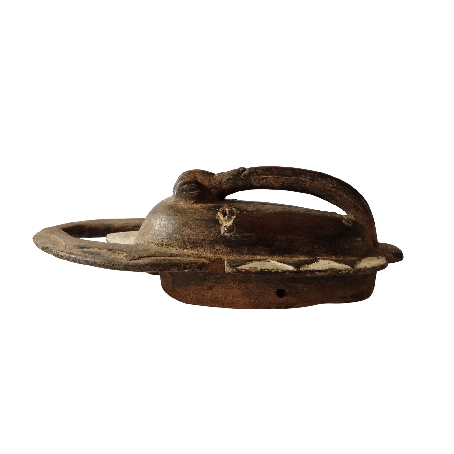 Side view of an African mask on a white background