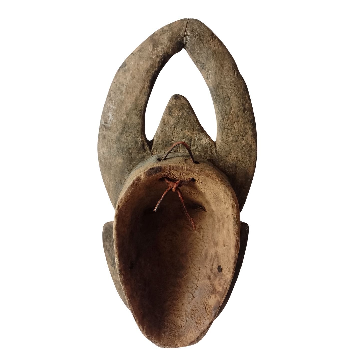 Vintage wooden mask with curved horns on a white background